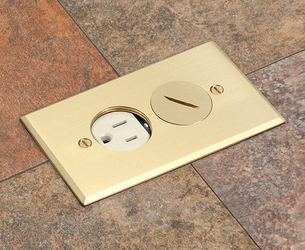 Installation shot of brass cover single gang power outlet floor box